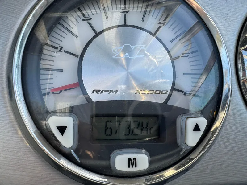 Slide: The Image of 2008 Nautique Super Air 220 RPM gauge displaying 672.4 hours. - 20