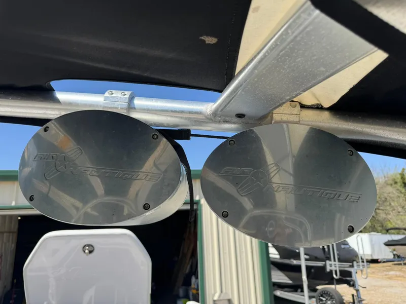Slide: The Image of 2008 Nautique Super Air 220 boat speakers mounted on a metal frame. - 25