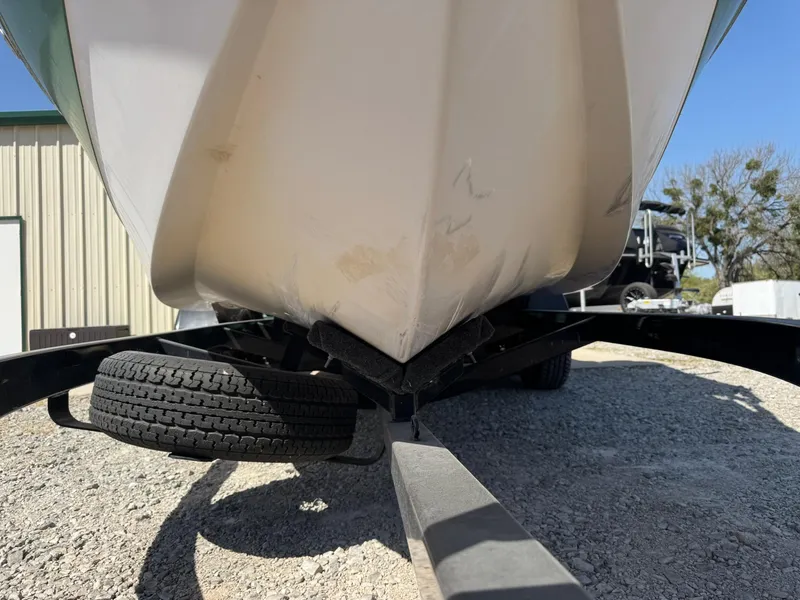 Slide: The Image of 2008 Nautique Super Air 220 boat on trailer, close-up of hull and tires. - 5