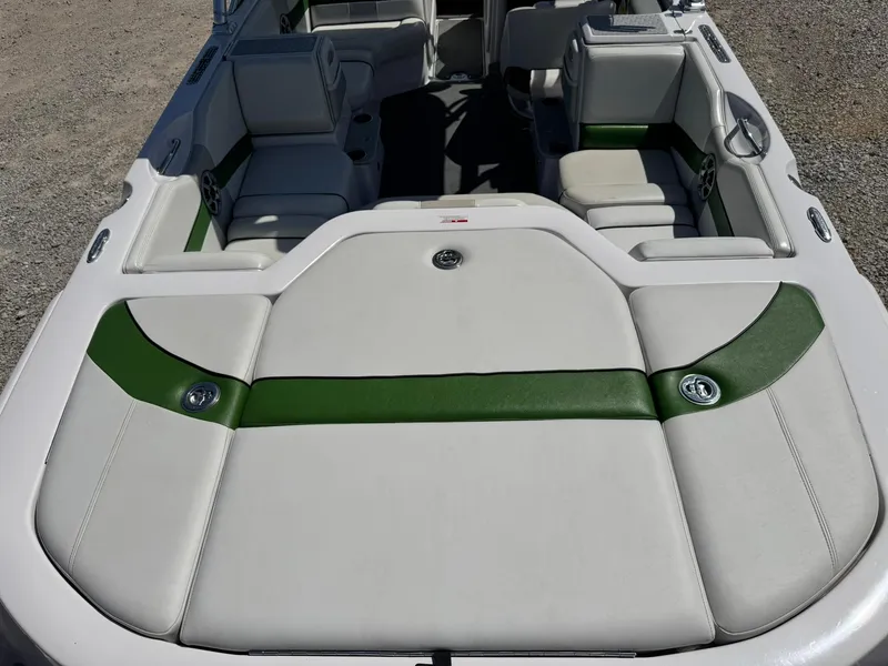 Slide: The Image of 2008 Nautique Super Air 220 boat interior with green and white seating. - 9