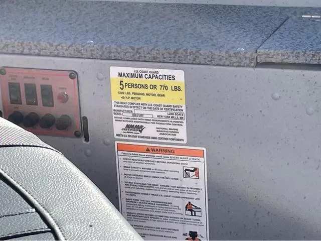 Slide: The Image of 2025 Lund Fury 1600 Tiller Heritage Edition capacity label, maximum 5 persons or 770 lbs. - 10