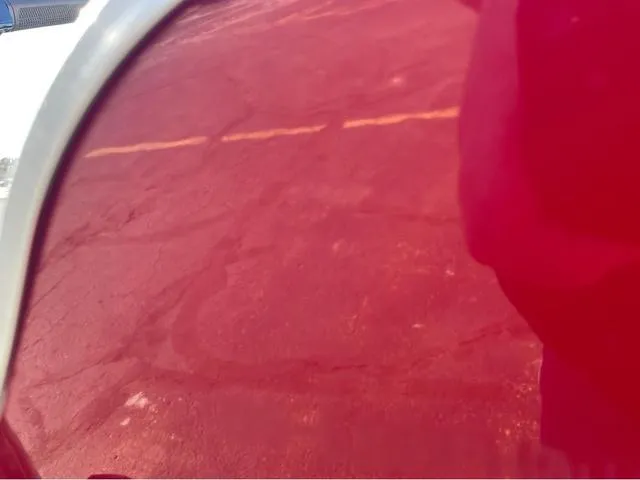 Slide: The Image of Close-up of red Lund Fury 1600 Tiller Heritage Edition, 2025 model. - 11