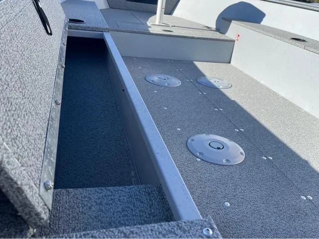 Slide: The Image of 2025 Lund Fury 1600 Tiller Heritage Edition boat interior with storage compartments. - 14