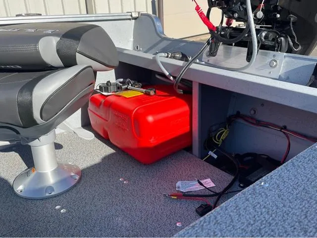 Slide: The Image of 2025 Lund Fury 1600 Tiller Heritage Edition interior with red fuel tank and seating. - 15