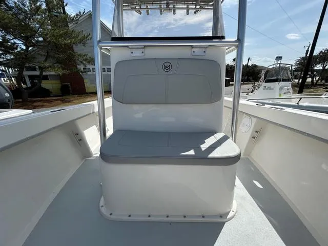 Slide: The Image of 2025 May-Craft 2000 Cape Classic boat interior with seating and console. - 13