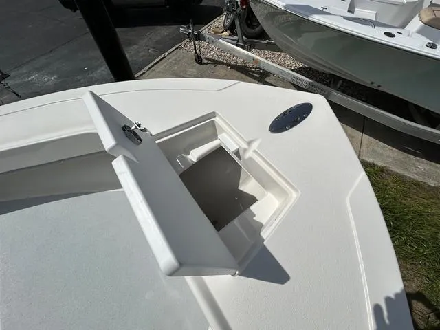 Slide: The Image of 2025 May-Craft 2000 Cape Classic boat with open storage compartment on deck. - 14