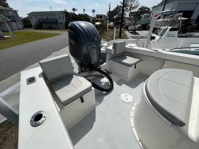 Slide: The Image of 2025 May-Craft 2000 Cape Classic boat with Yamaha outboard motor, docked in a marina. - 6