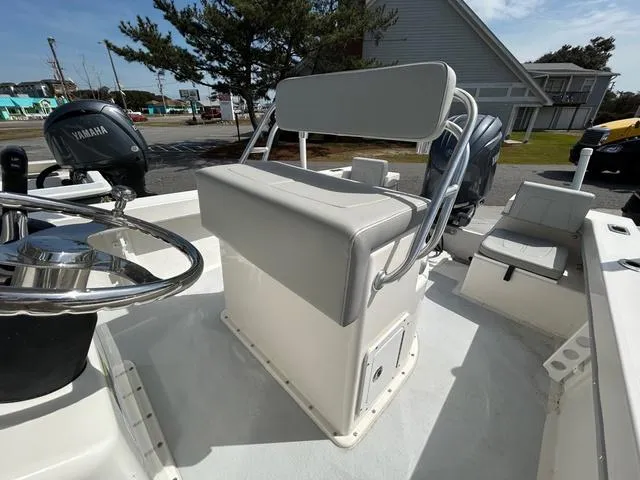 Slide: The Image of 2025 May-Craft 2000 Cape Classic boat interior with steering wheel and seating. - 8