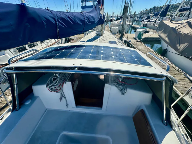 Slide: The Image of Valiant 39 sailboat, 1996 model, with solar panels on deck, docked at marina. - 14