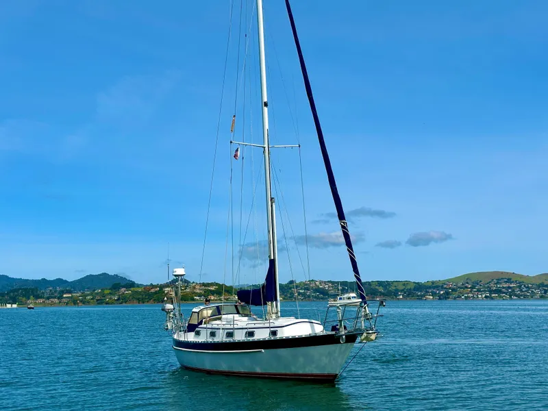 Slide: The Image of Sailboat Valiant 39, 1996 model, anchored in scenic bay with clear blue sky. - 2