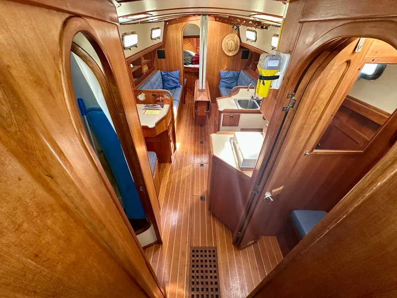Slide: The Image of Interior of 1996 Valiant 39 sailboat with wooden finish and cozy seating area. - 23