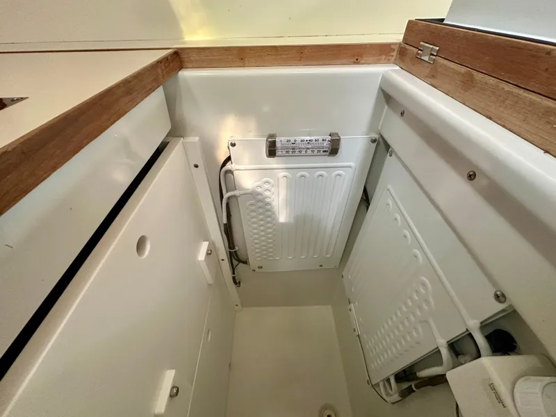 Slide: The Image of Interior view of a 1996 Valiant 39 sailboat, featuring a compact storage area. - 35