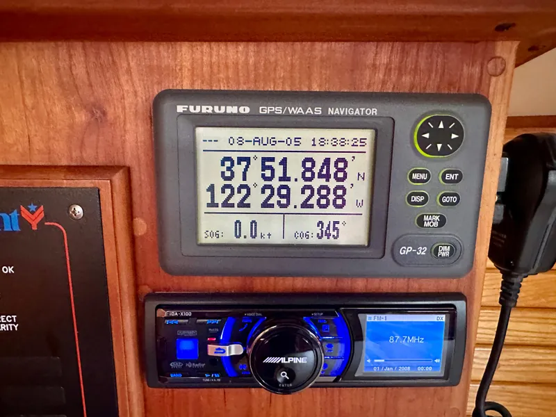 Slide: The Image of Furuno GPS navigator on 1996 Valiant 39, displaying coordinates and speed. - 53