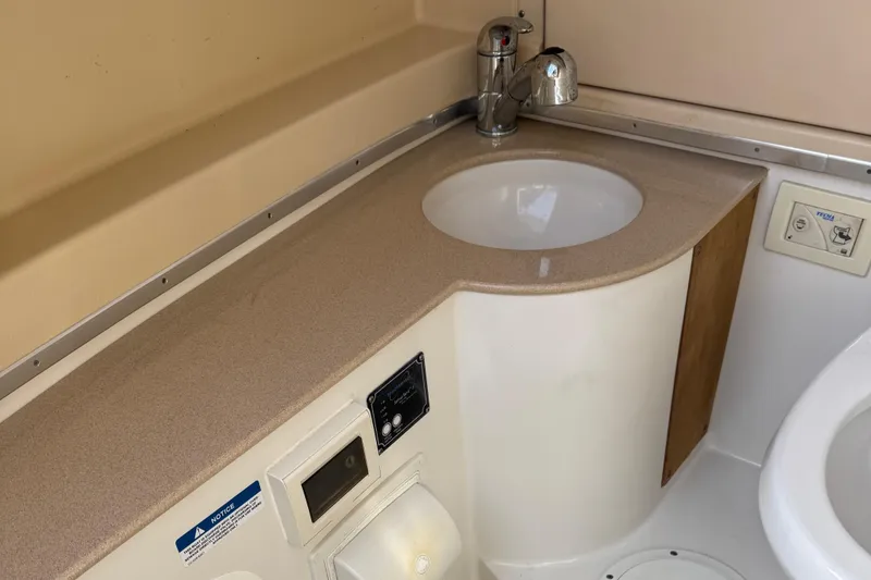 Slide: The Image of 2015 Chris-Craft Catalina 29 boat interior with sink and countertop. - 16