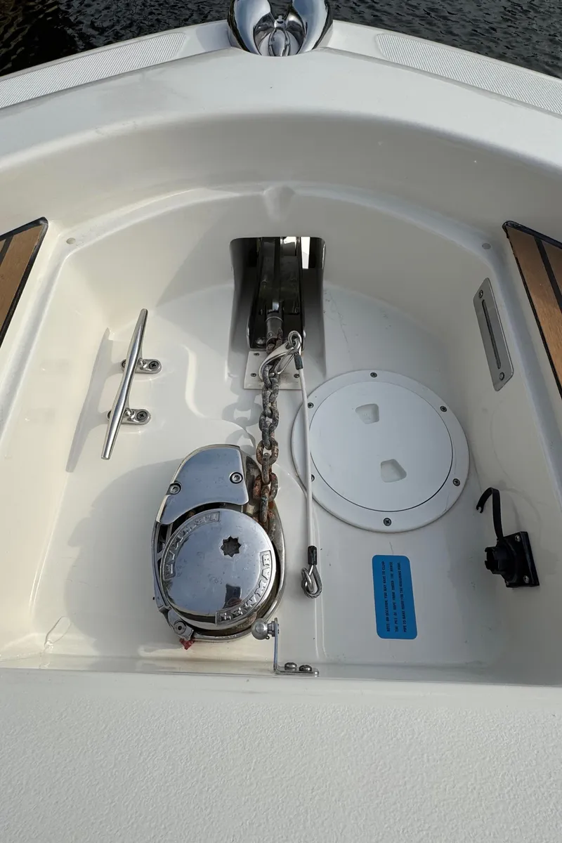 Slide: The Image of 2015 Chris-Craft Catalina 29 anchor compartment with winch and cleat. - 20