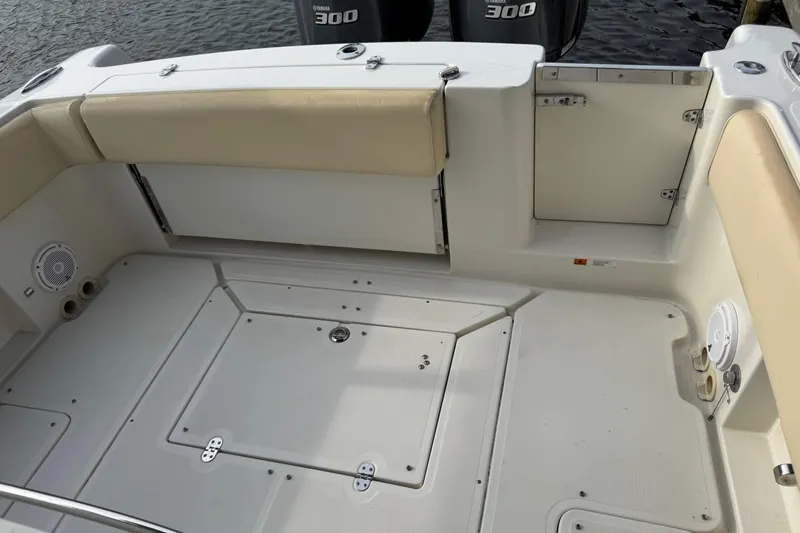 Slide: The Image of 2015 Chris-Craft Catalina 29 boat deck with seating and storage compartments. - 21