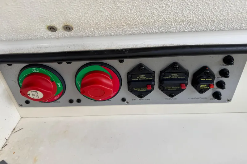 Slide: The Image of Control panel of a 2015 Chris-Craft Catalina 29 boat with switches and dials. - 26