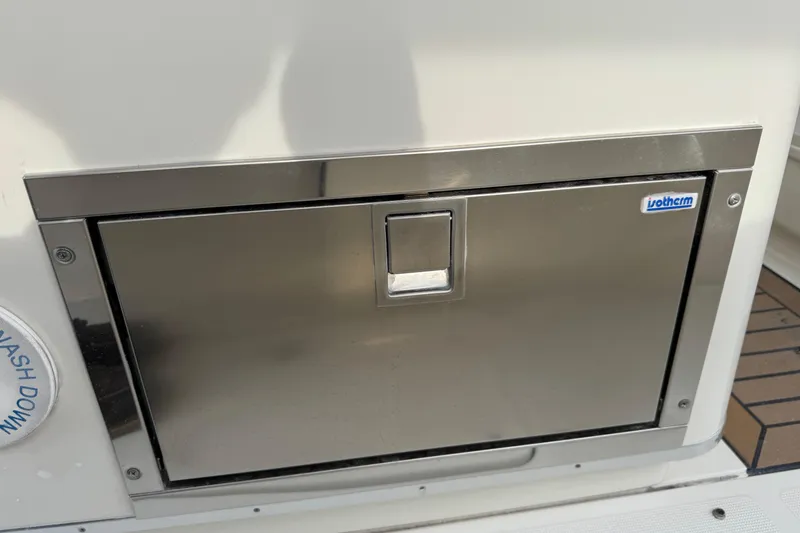 Slide: The Image of Stainless steel storage compartment on 2015 Chris-Craft Catalina 29 boat. - 27