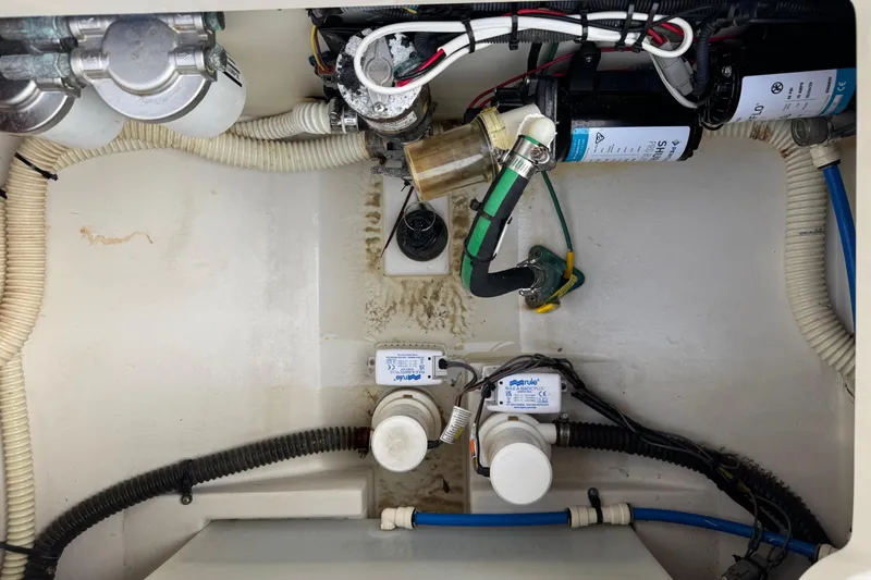 Slide: The Image of Engine compartment of a 2015 Chris-Craft Catalina 29, showcasing wiring and components. - 29