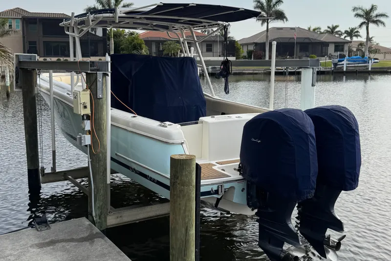 Slide: The Image of 2015 Chris-Craft Catalina 29 boat docked with twin engines, covered and elevated. - 3