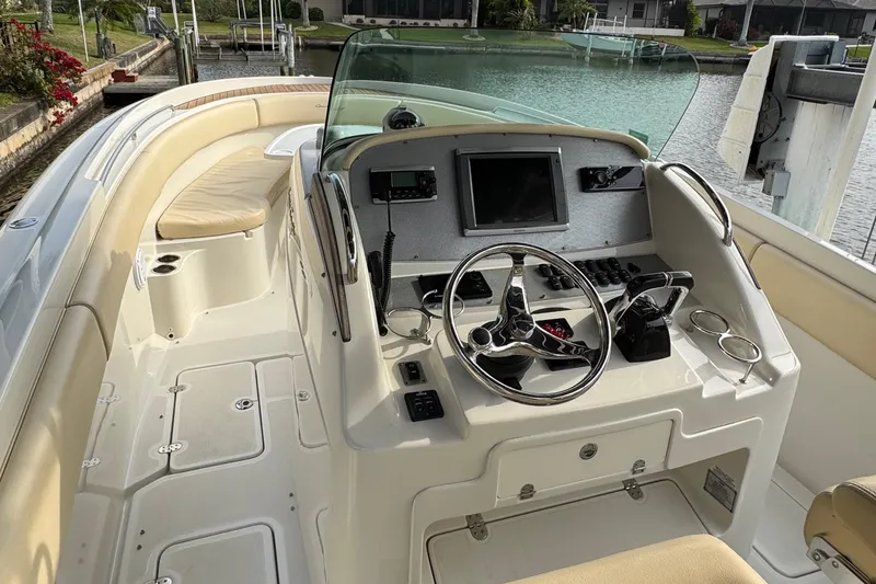 Slide: The Image of 2015 Chris-Craft Catalina 29 boat cockpit with steering wheel and control panel. - 5