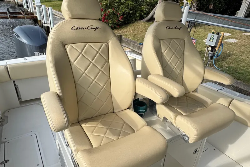Slide: The Image of Luxurious beige seats on a 2015 Chris-Craft Catalina 29 boat, featuring diamond stitching. - 8