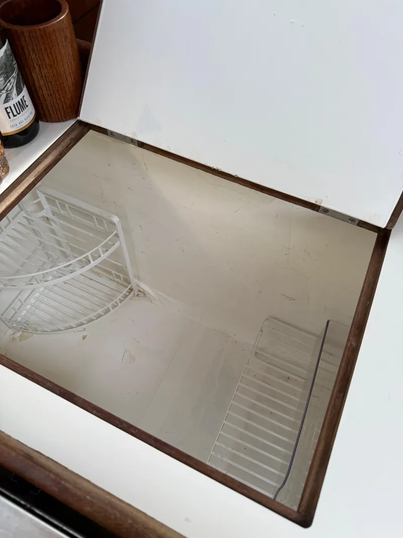 Slide: The Image of Open storage compartment in 1986 Catalina 36 sailboat interior. - 10
