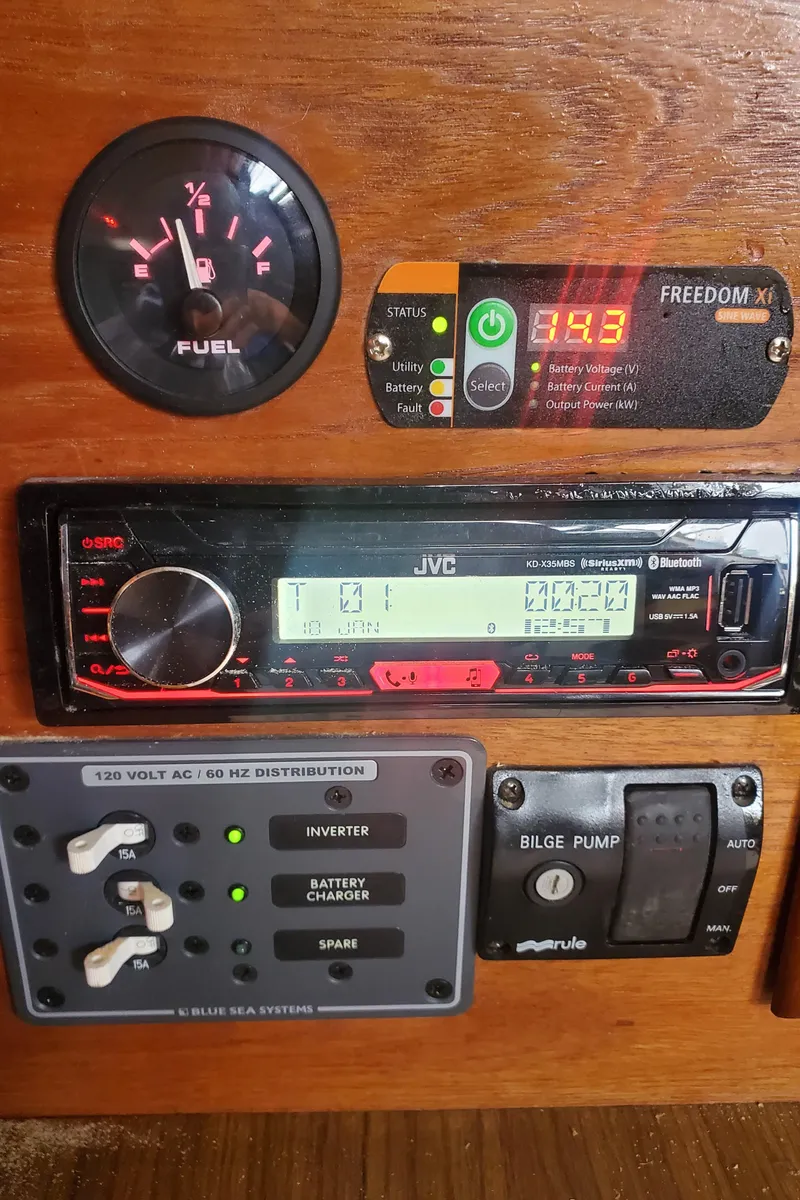 Slide: The Image of Control panel of a 1986 Catalina 36 boat with fuel gauge and electronic displays. - 15