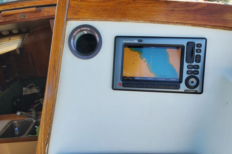 Slide: The Image of Navigation system on 1986 Catalina 36 sailboat with wooden interior details. - 24