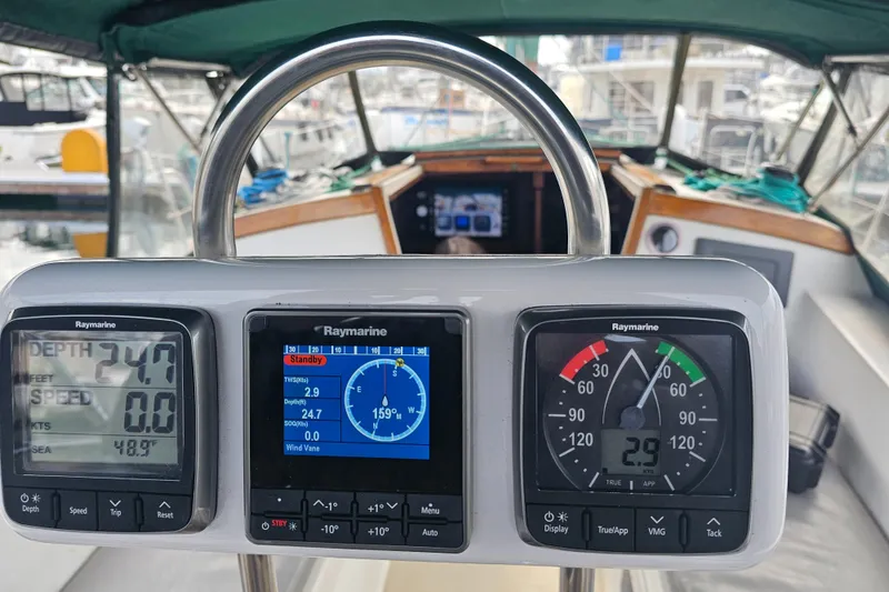 Slide: The Image of Cockpit of 1986 Catalina 36 sailboat with Raymarine navigation instruments. - 25