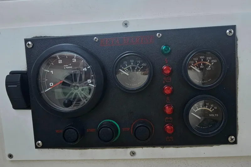 Slide: The Image of Control panel of a 1986 Catalina 36 sailboat with gauges and indicators. - 28
