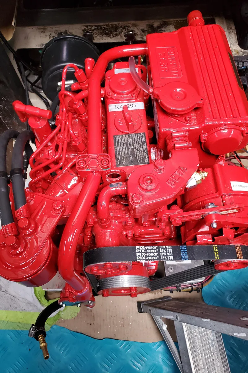 Slide: The Image of Red engine of a 1986 Catalina 36 sailboat, showcasing detailed components and vibrant color. - 29