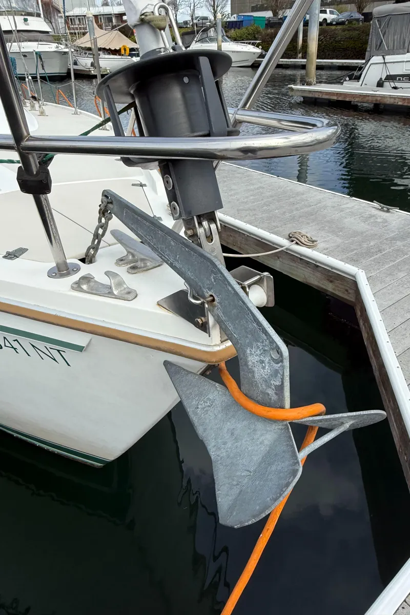 Slide: The Image of 1986 Catalina 36 sailboat with anchor and orange rope at dock. - 40