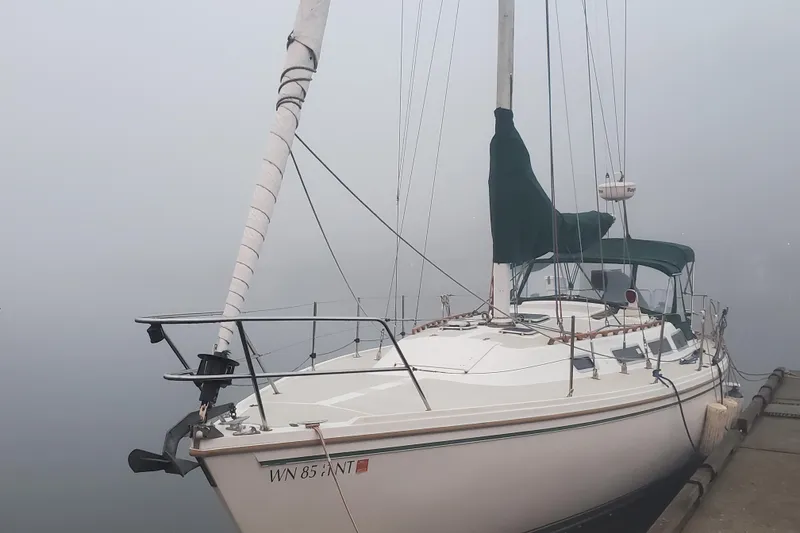 Slide: The Image of 1986 Catalina 36 sailboat docked in foggy marina. - 47