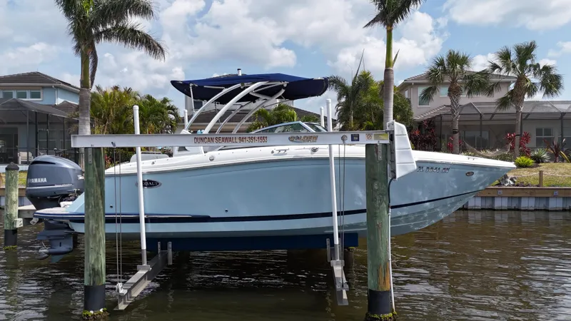 Slide: The Image of 2019 Cobalt 25 SC boat with Yamaha 300 engine on lift, fresh water use. - 1