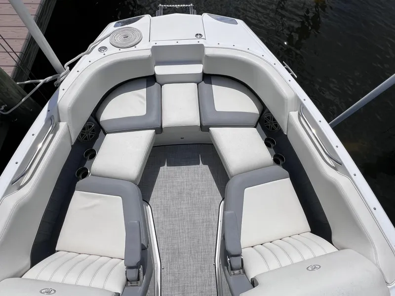 Slide: The Image of 2019 Cobalt 25 SC boat interior with gray and white seating, fresh water use. - 16