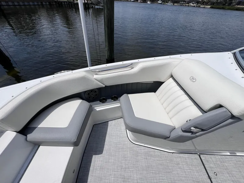 Slide: The Image of 2019 Cobalt 25 SC boat interior with gray seating, fresh water use. - 18