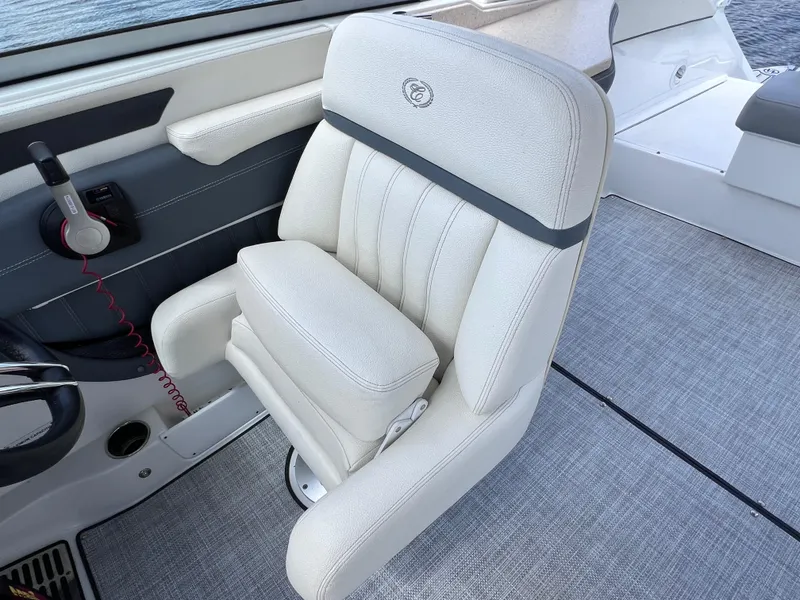 Slide: The Image of Luxurious white captain's chair on 2019 Cobalt 25 SC boat, fresh water use. - 26