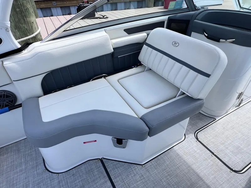 Slide: The Image of 2019 Cobalt 25 SC boat interior with gray and white seating, fresh water use. - 30