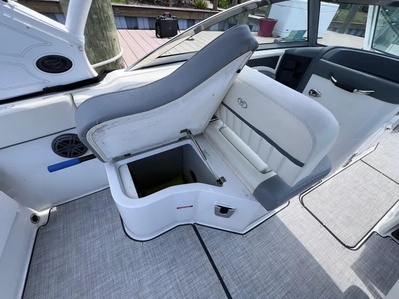 Slide: The Image of 2019 Cobalt 25 SC boat interior with open storage under seat, fresh water use. - 49