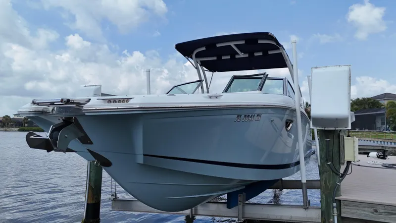 Slide: The Image of 2019 Cobalt 25 SC boat with Yamaha 300 engine, docked in fresh water. - 6