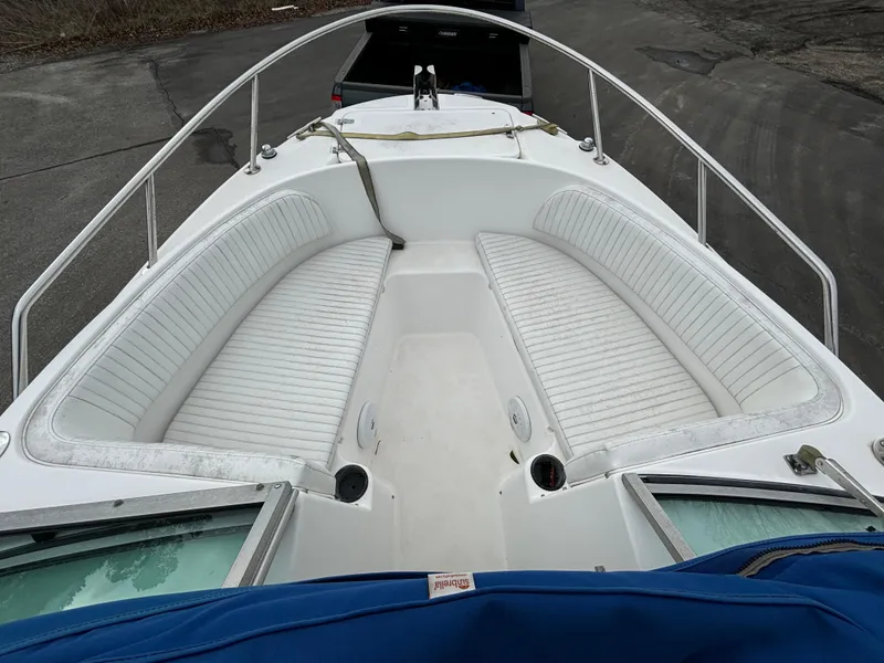 Slide: The Image of 2002 Boston Whaler 210 Ventura boat with white seating and stainless steel railings. - 8