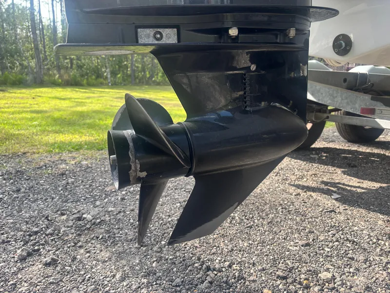 Slide: The Image of Propeller of 2022 Bayliner Trophy T20CX boat on gravel surface. - 13