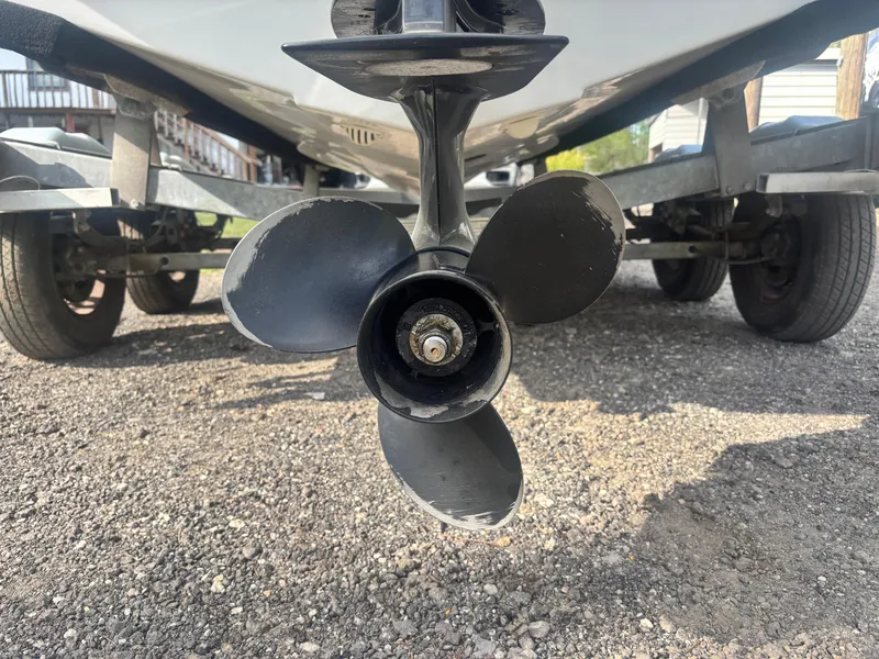 Slide: The Image of Propeller of 2022 Bayliner Trophy T20CX boat on trailer, close-up view. - 14