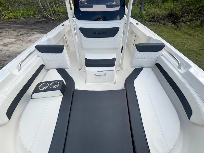 Slide: The Image of 2022 Bayliner Trophy T20CX boat interior with cushioned seating and cup holders. - 30