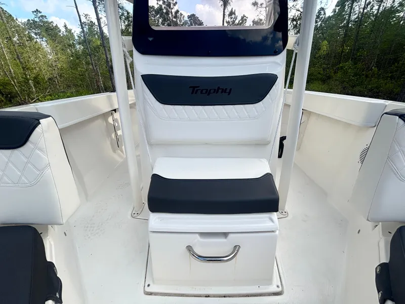 Slide: The Image of 2022 Bayliner Trophy T20CX boat interior with seating and storage. - 32