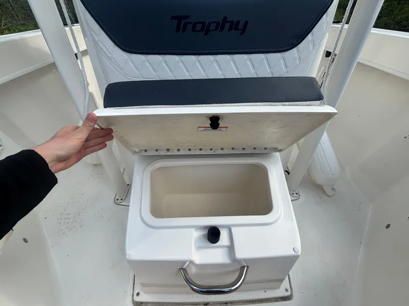 Slide: The Image of 2022 Bayliner Trophy T20CX boat seat with storage compartment open. - 33