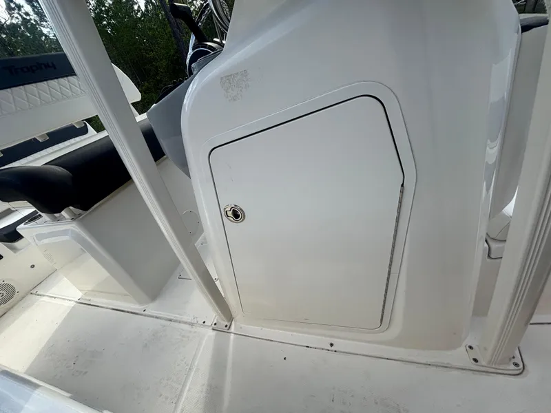 Slide: The Image of 2022 Bayliner Trophy T20CX boat interior with storage compartment and seating. - 34