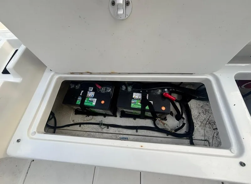 Slide: The Image of Battery compartment of 2022 Bayliner Trophy T20CX boat, showing two batteries and wiring. - 40