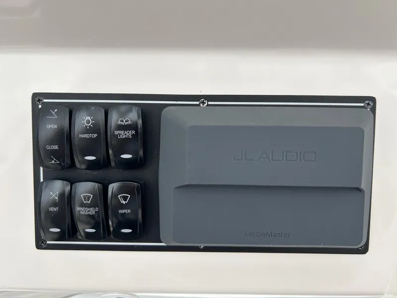 Slide: The Image of Control panel of a 2021 Pursuit S 328 Sport boat with JL Audio system. - 11
